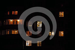 Apartment house windows at night