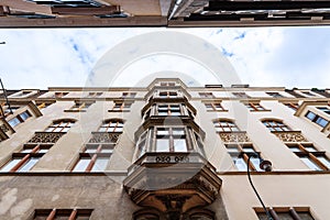 Apartment houses on narrow street in Vienna , Austria