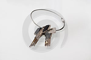 . apartment keys on a white background. shallow depth of field. there is no isolation