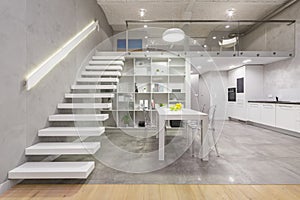 Apartment with modern white staircase