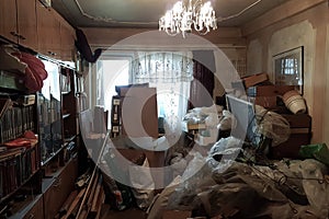 Apartment of a pensioner littered with trash and books