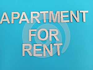 Apartment for rent sign on a blue background