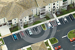 Apartment residential condos with car parking place in Florida suburban area. American condominiums as example of real