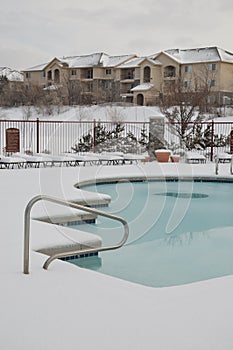 Apartments and swimming pool in the snow