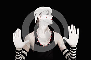 Ape mime in striped gloves and white hat