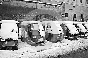 Ape Piaggio parked in the snow.