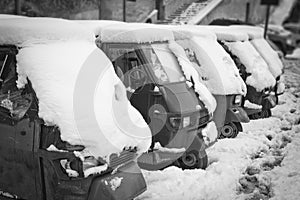 Ape Piaggio parked in the snow.