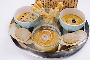 aperitif with hummus, mincemeat and pike caviar