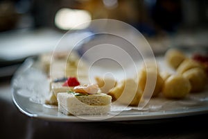 Aperitif with white bread, mayonnaise, caviar, shrimp and basil