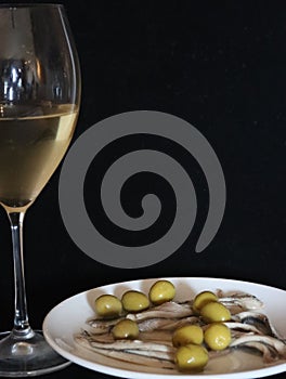 Aperitif white wine olives anchovies food drink glass photo