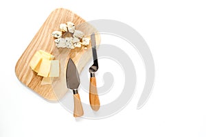 Aperitive parmesan cheese and cheese with blue mould on a cutting board on white background top view space for text