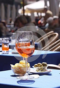 Aperol glasses at an outdoor cafe