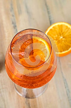 Aperol Spritz cocktail in glass on wood.