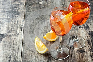 Aperol spritz cocktail in glass on wood