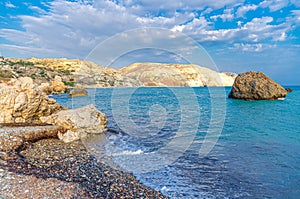 Aphrodite Beach with Stone Rocks in Aphrodite bay of Mediterranean sea water photo