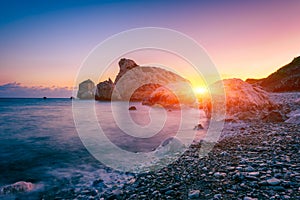 Aphrodite`s Rock beach, Petra tou Romiou, the birthplace of Goddness Aphrodite, Paphos, Cyprus. Amazing sunset seascape