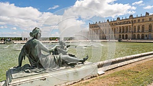 Aphrodites and cupid sculpture in the garden of Versailles palce photo