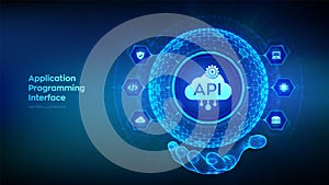 API. Application Programming Interface in the shape of sphere with hexagon grid pattern in wireframe hand. Software development