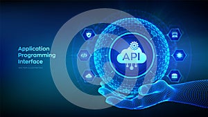 API. Application Programming Interface in the shape of sphere with hexagon grid pattern in wireframe hand. Software development