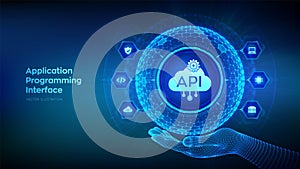 API. Application Programming Interface in the shape of sphere with hexagon grid pattern in wireframe hand. Software development