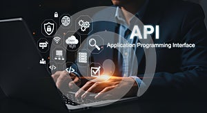 API concept with icons and person using laptop application programming interface