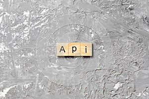 API word written on wood block. application program interface text on table, concept