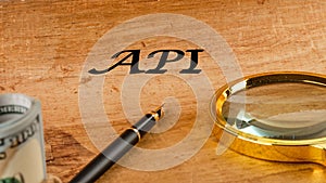API (application program interface). The concept of technology and development. Phrase, words, text API written