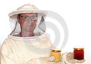 Apiarist takes two honey glasses