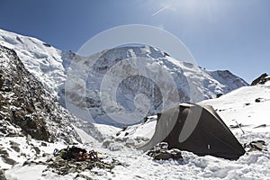 Apinist tent near the Tete Rousse refuge view in the French Alps, Mont Blanc massif, Chamonix Mont-Blanc, France