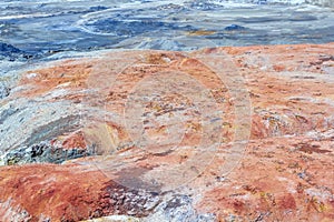 Apocalyptic landscape like a planet Mars surface. Solidified red-brown black Earth surface. Barren, cracked and scorched land.