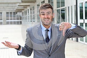 Apologetic businessman giving a thumbs down