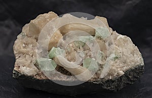 apophyllite and stilbite mineral sample on black background