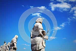 Apostles statues on the roof of St Peter`s Basilica in Vatican city, Rome, Italy