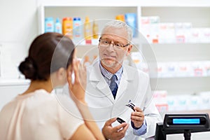 Apothecary with cure and customer at pharmacy