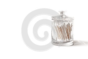 Apothecary jar full of cotton swabs photo