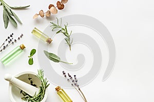 Apothecary of natural wellness and self-care. Herbs and medicine on white background top view frame copy space photo