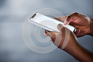 This app could be of great use. an unrecognizable woman using her cellphone at the gym.