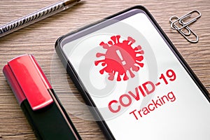 App for infected with covid 19 virus with notification red tracking on the phone screen. smartphone application for infected with