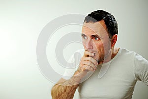 Appalled man emotional guy feeling sinking heart shortness of breath about emotional stress sensations isolated on grey