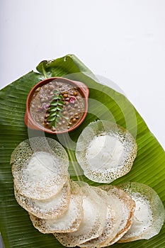 Appam with kadala curry on fresh banana leaf