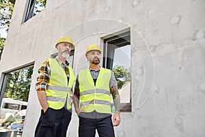 appealing devoted builders in safety helmets