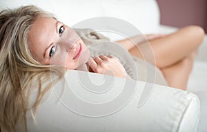 Appealing young woman on a sofa