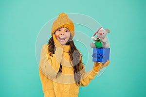 Appease with gift. Shopping tips. Rat symbol of year. Happy girl hold mouse toy and wrapped gift box. Kid knitted