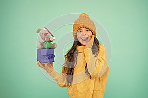 Appease with gift. Shopping tips. Rat symbol of year. Happy girl hold mouse toy and wrapped gift box. Kid knitted