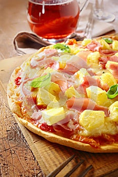 Appetising ham and pineapple Italian pizza