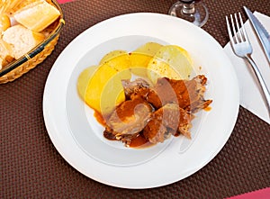 Appetising sliced pork served with potato