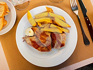 Appetising sliced pork served with potato