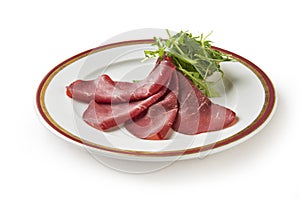 Appetizer of bresaola and arugula