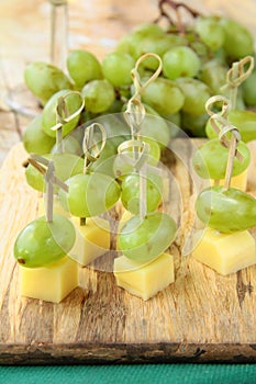 Appetizer canape cheese with white grapes