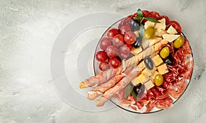 Appetizer catering platter on concrete background. Overhead, copy space.